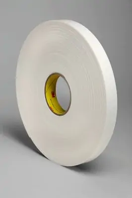 White roll of 3M 4466W Double Coated Polyethylene Foam Tape with yellow core on grey background.