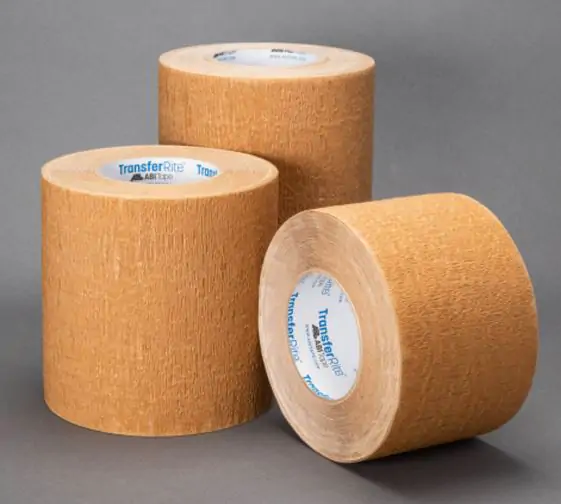 Three different sized rolls of tufbak 6932 on a grey surface
