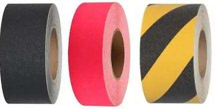 Three rolls of Jessup Safety Track Tapes. One black, one pink, and one with a yellow and black striped pattern.