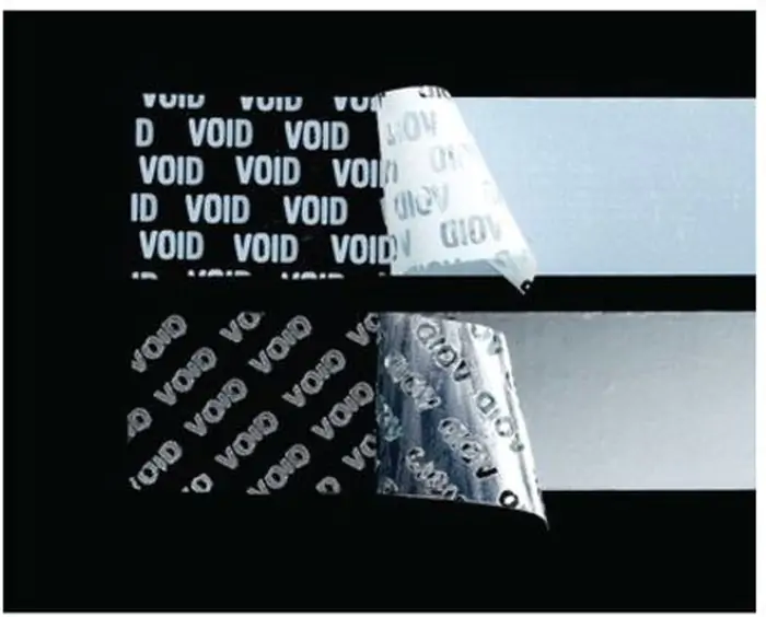 2 lines of 3M 7937 Matte White Tamper Evident Void Label on black background.
