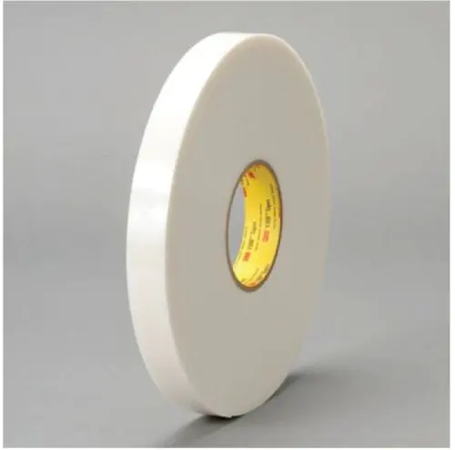 White roll of 3M 4951 VHB White Acrylic Foam Tape with yellow core on grey background.