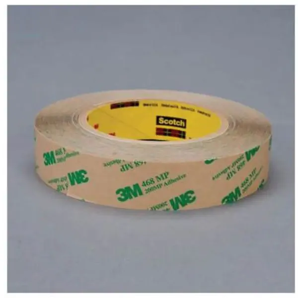 Brown roll of 3M 468MP Adhesive Transfer Tape with green 3M logo pattern laying on its side.