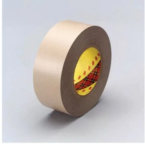 Brown roll of 3M 9471LE Laminating Adhesive with red and yellow core.