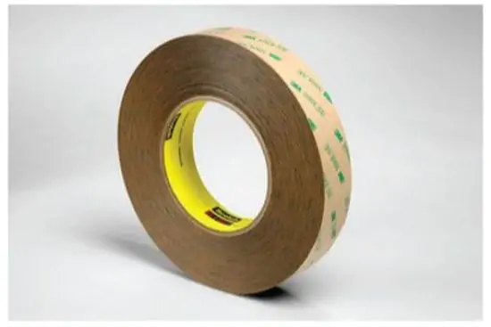 Brown roll of 3M 9472LE Laminating Adhesive with green 3M logo pattern on kraft paper liner.