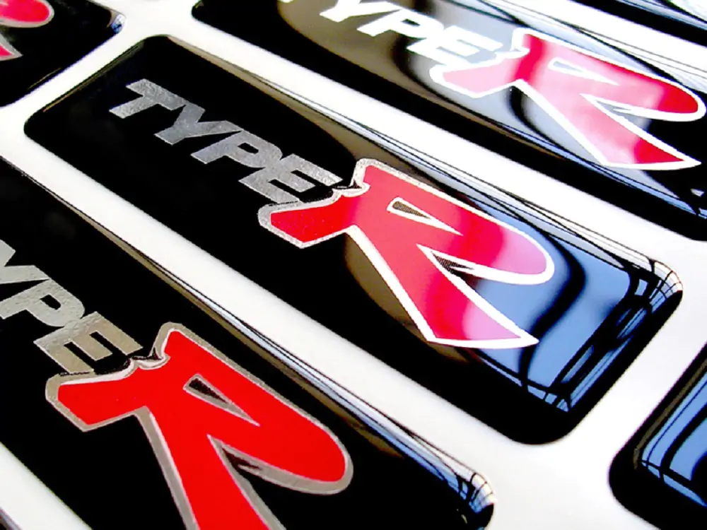 Black, silver, and red "Type R" logo placards.
