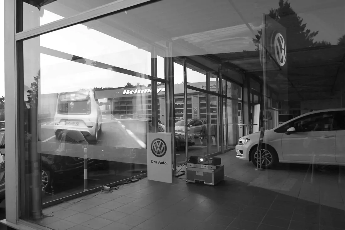 Rear projection graphics inside car dealership