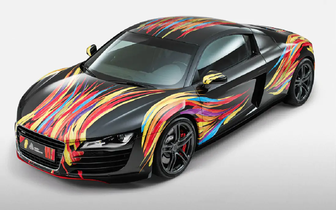 Black car wrapped in colourful vinyl with a paint stroke design.