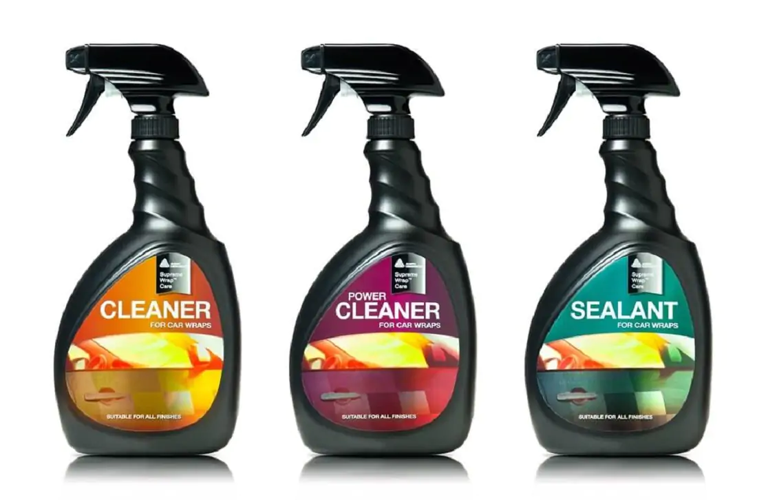 Three black spray bottles: two Avery Supreme Wrap Cleaners and one Avery Sealant for car wraps.