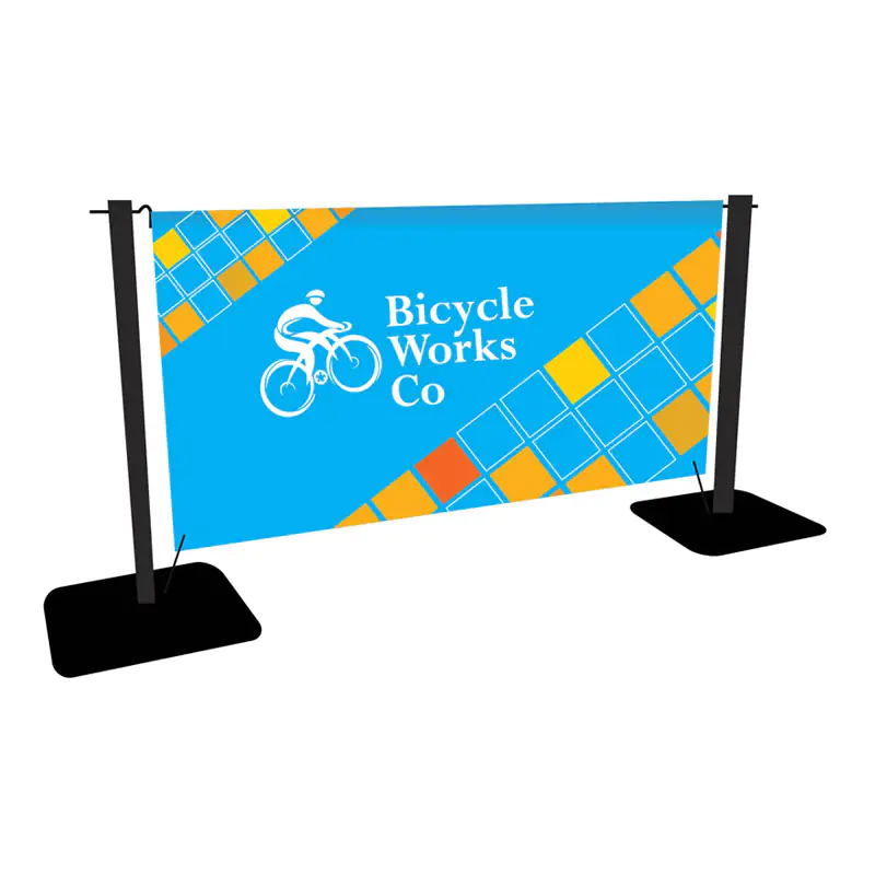 A blue and yellow banner bicycle works co and a bike image, being held by black stands. BannerBrite 13oz 1000D
 