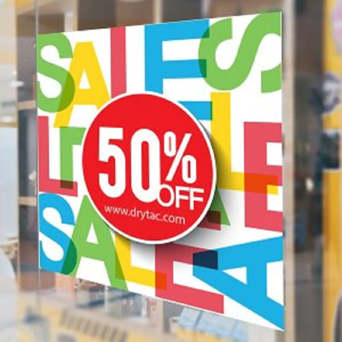 Colourful Sale sign on a window of the store 