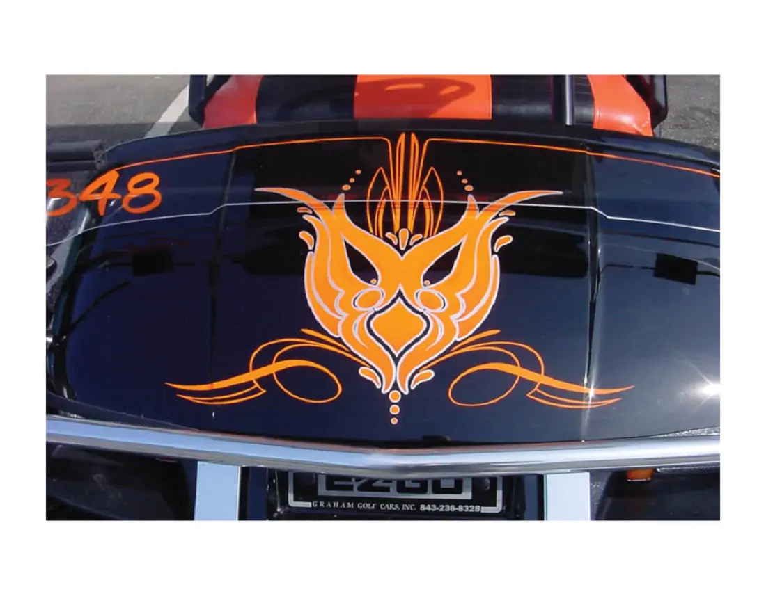 Orange flame design on the hood of a black car.