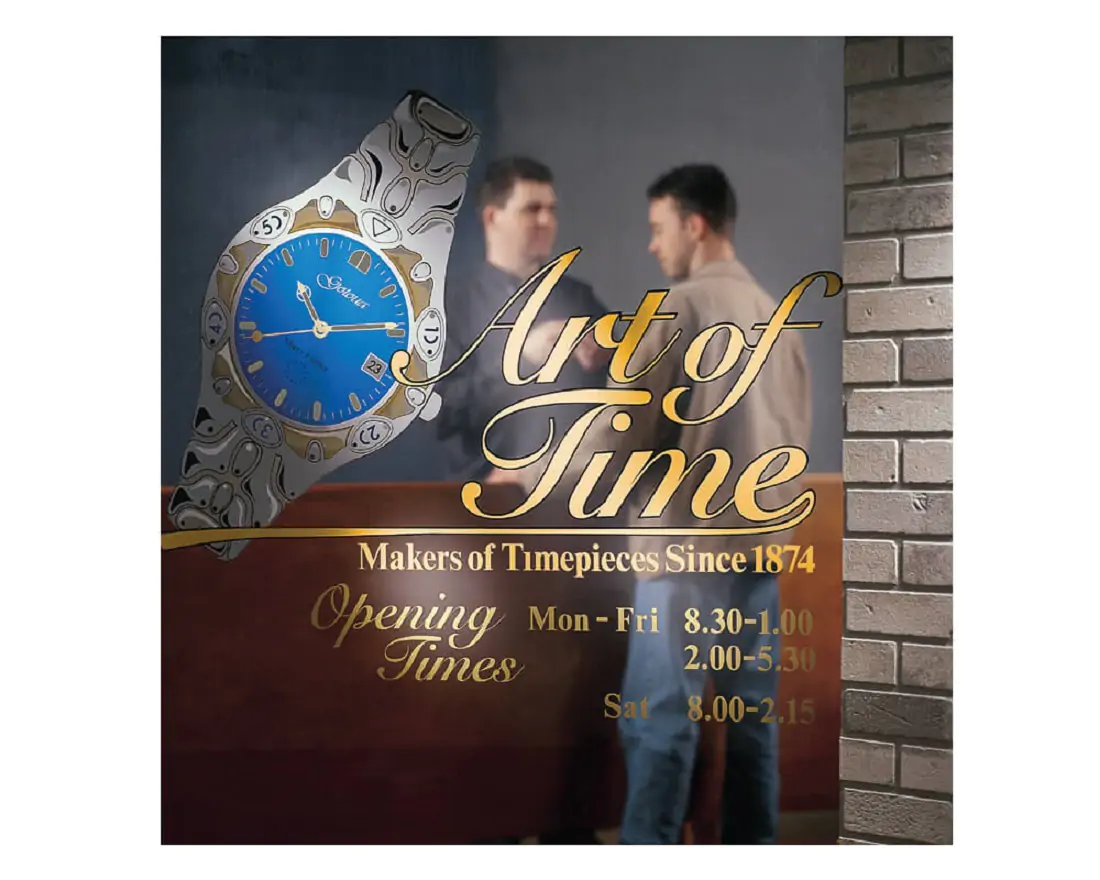 Advertisement  with gold lettering showcasing a wrist watch.