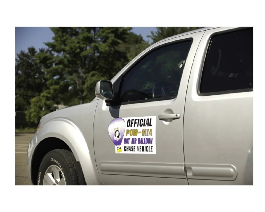 Silver vehicle with magnet graphics on the drivers side door