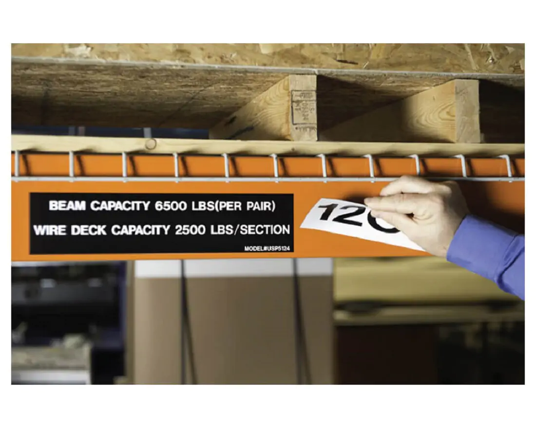 Beam weight capacity sticker on warehouse shelve 