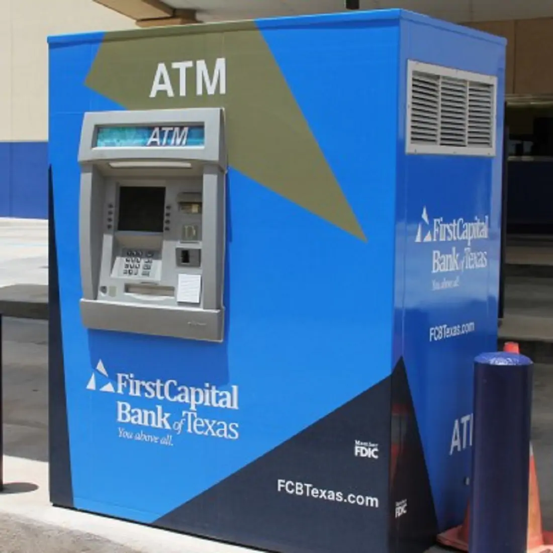Outdoor ATM wrapped in blue vinyl