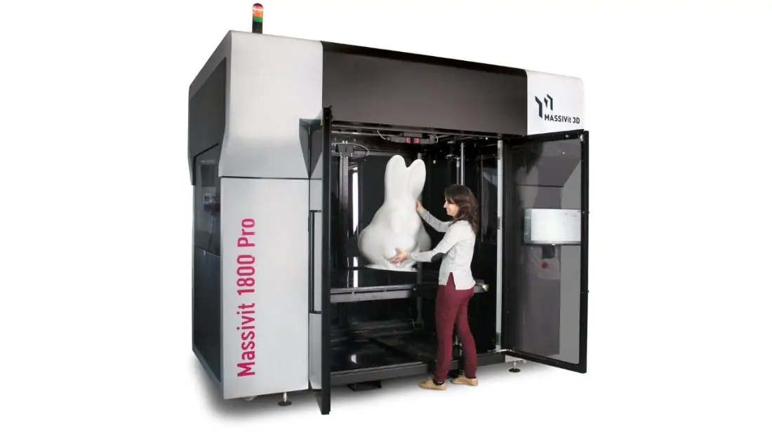 Woman taking a large 3D print out of the Massive Pro Printer