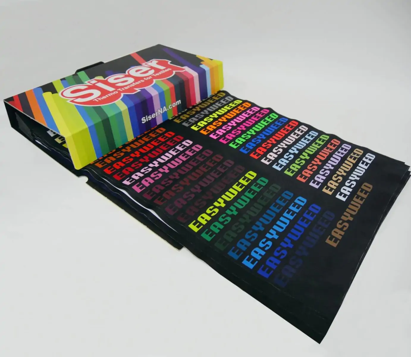 Box of Siser colour samples printed on black cloth material