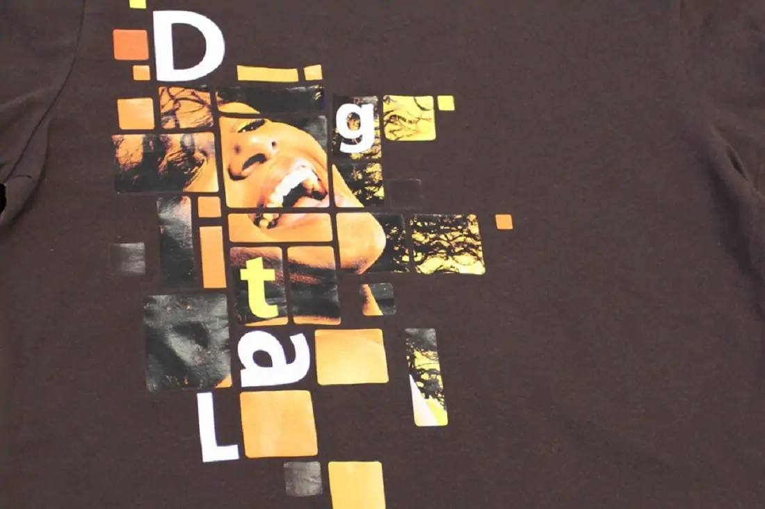 A black shirt with a women as a design with blocks around her 