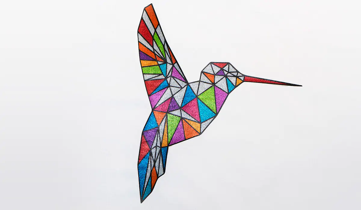 sprakly colourful humming bird printed on a tshirt using siser Sparkleprint Printable HTV