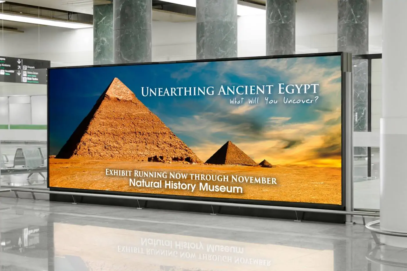A big sign with an exhibit history poster showing Egypt